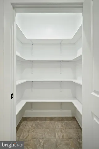 a bathroom with a sink vanity and a mirror