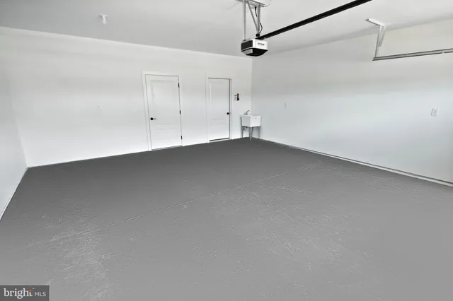 a bathroom with a sink a mirror and a shower