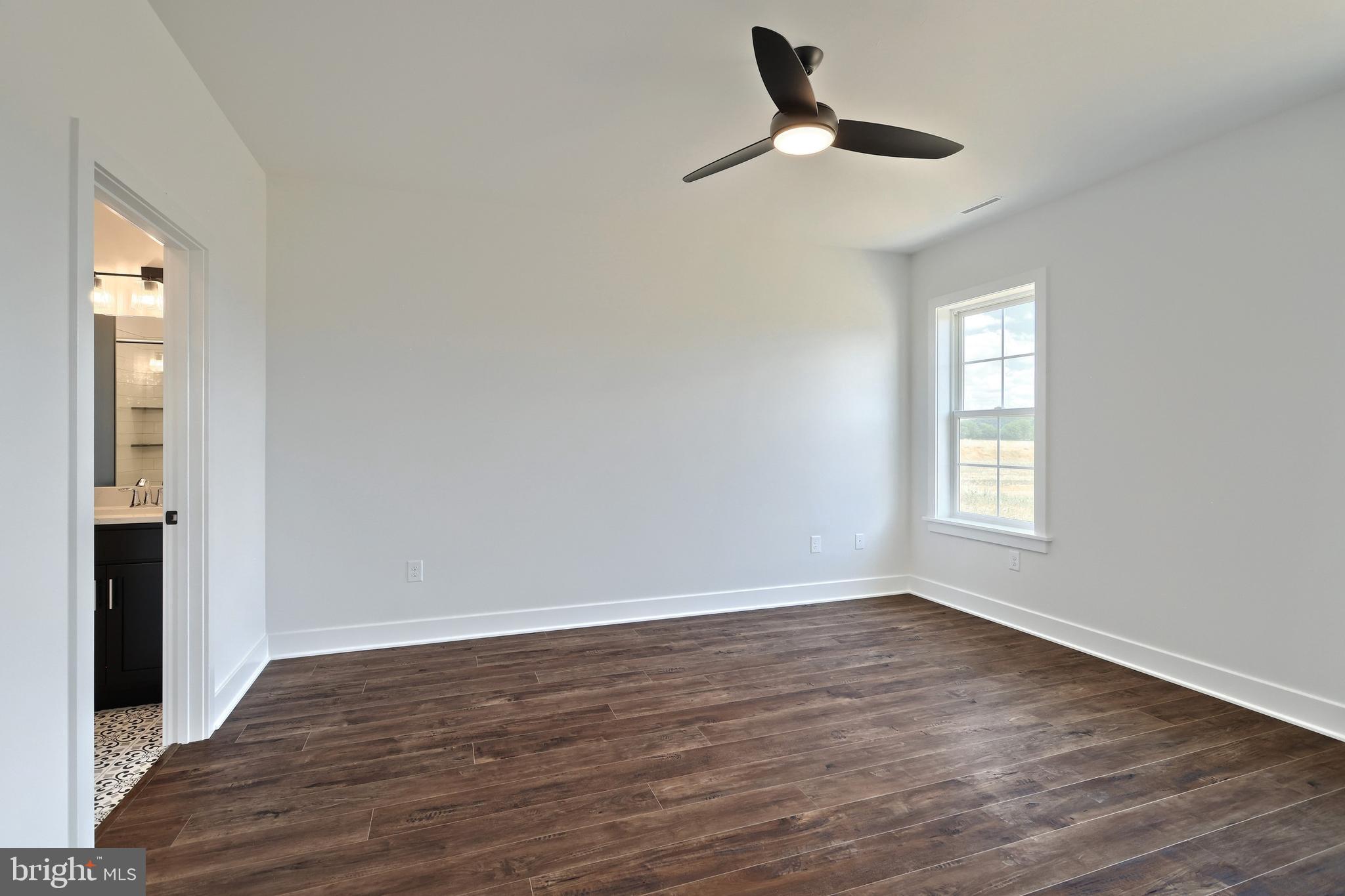 559 Lumber Street Littlestown, PA 17340 - Photo 31 of 73 a view of empty room with wooden floor and fan