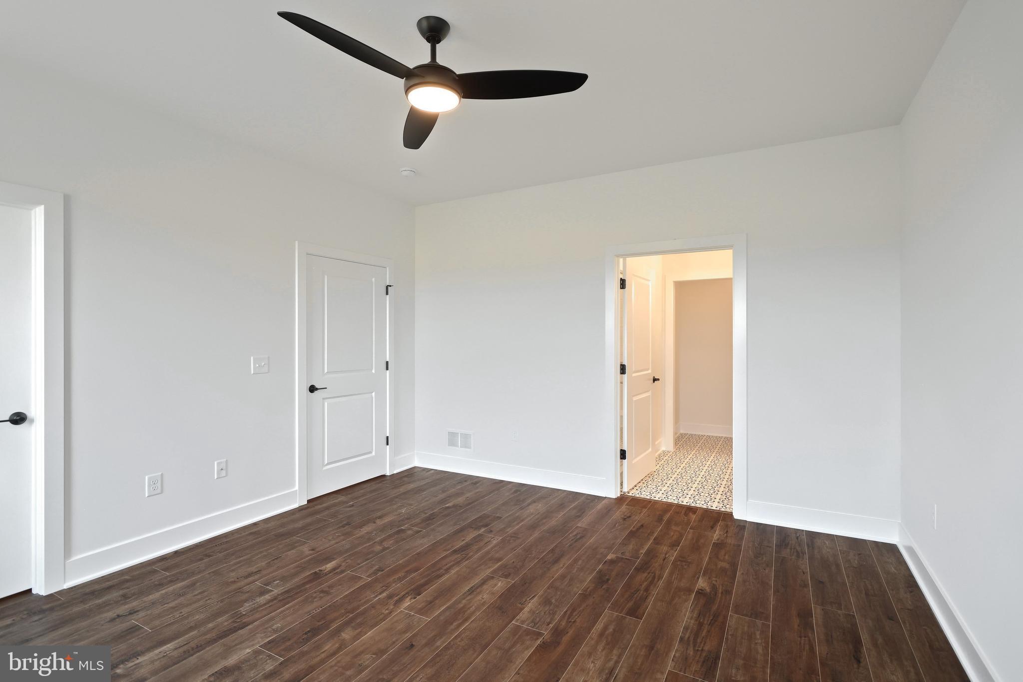 559 Lumber Street Littlestown, PA 17340 - Photo 32 of 73 an empty room with wooden floor cabinet and ceiling fan