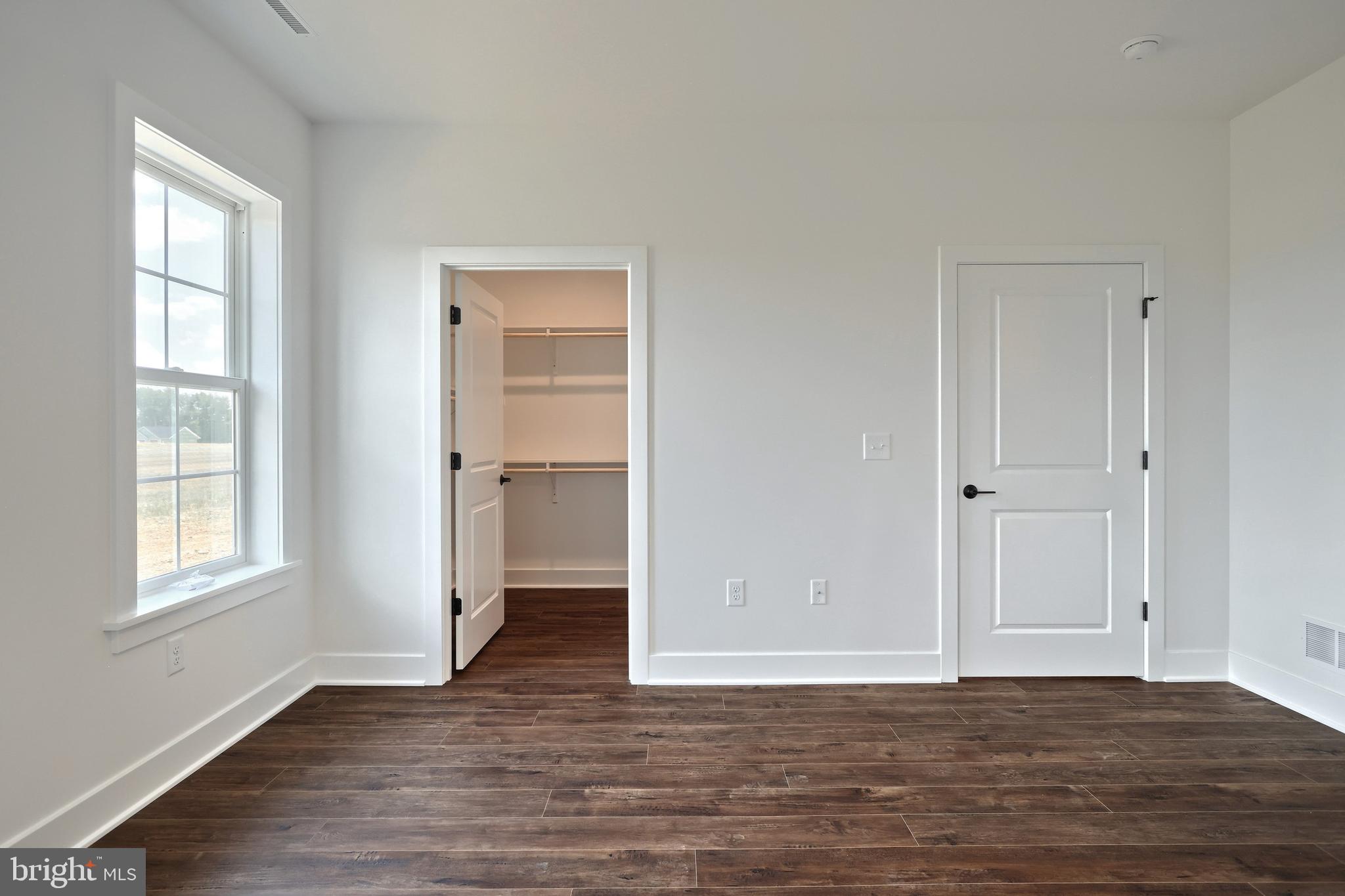 559 Lumber Street Littlestown, PA 17340 - Photo 33 of 73 a view of an empty room with window and wooden floor