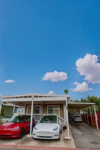 a view of house with car parked