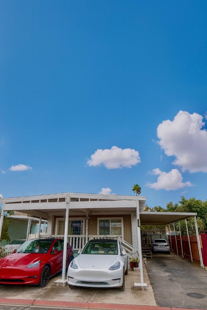a view of house with car parked