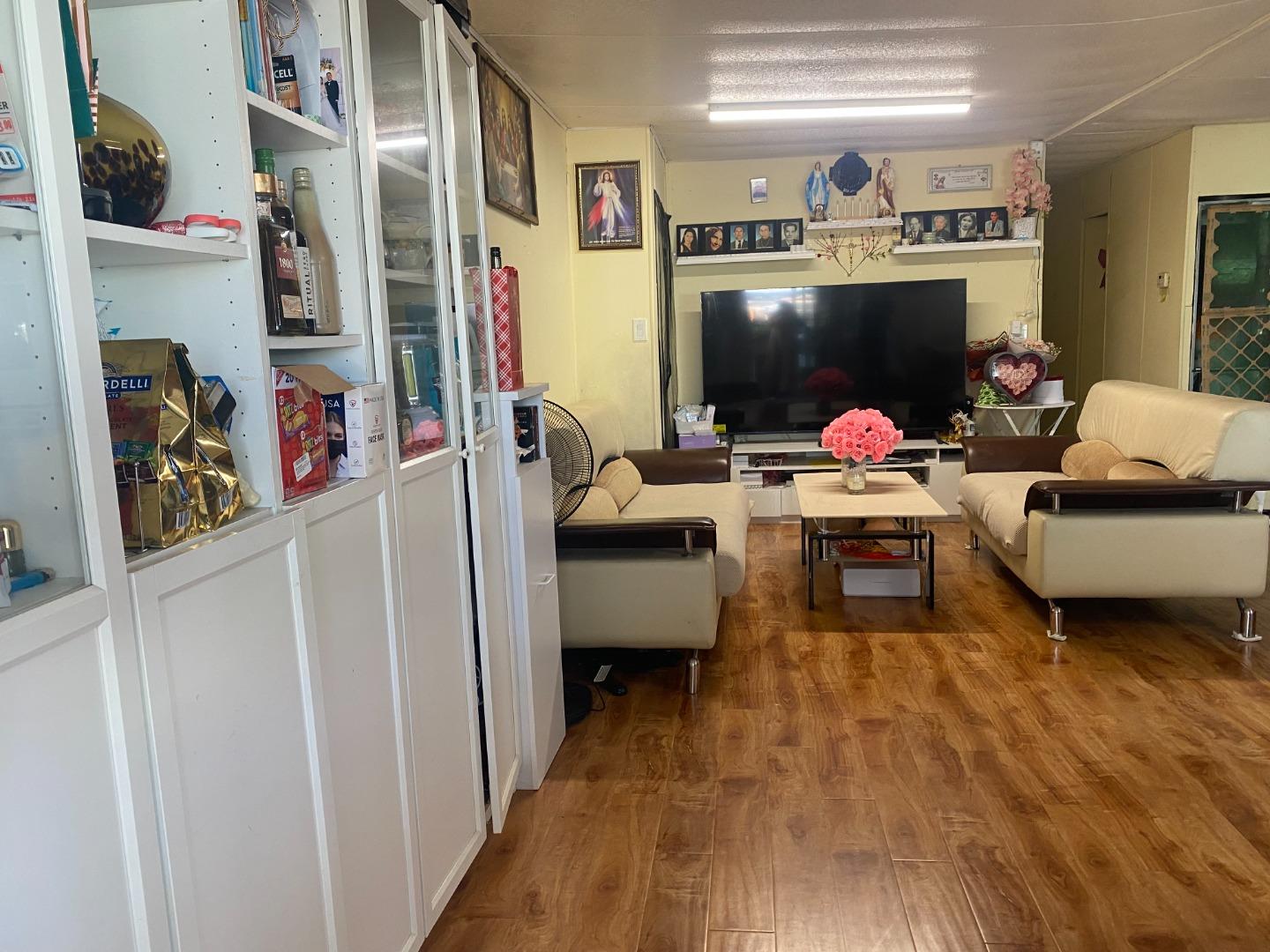 2580 Senter Road, Unit 424 San Jose, CA 95111 - Photo 7 of 12 a living room with furniture and a flat screen tv
