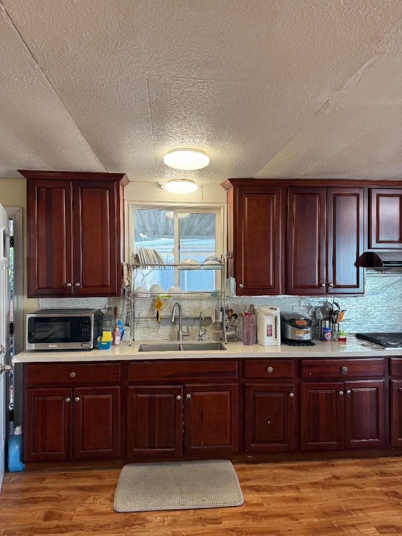 2580 Senter Road, Unit 424 San Jose, CA 95111 - Photo 10 of 12 a kitchen with a sink and a cabinets