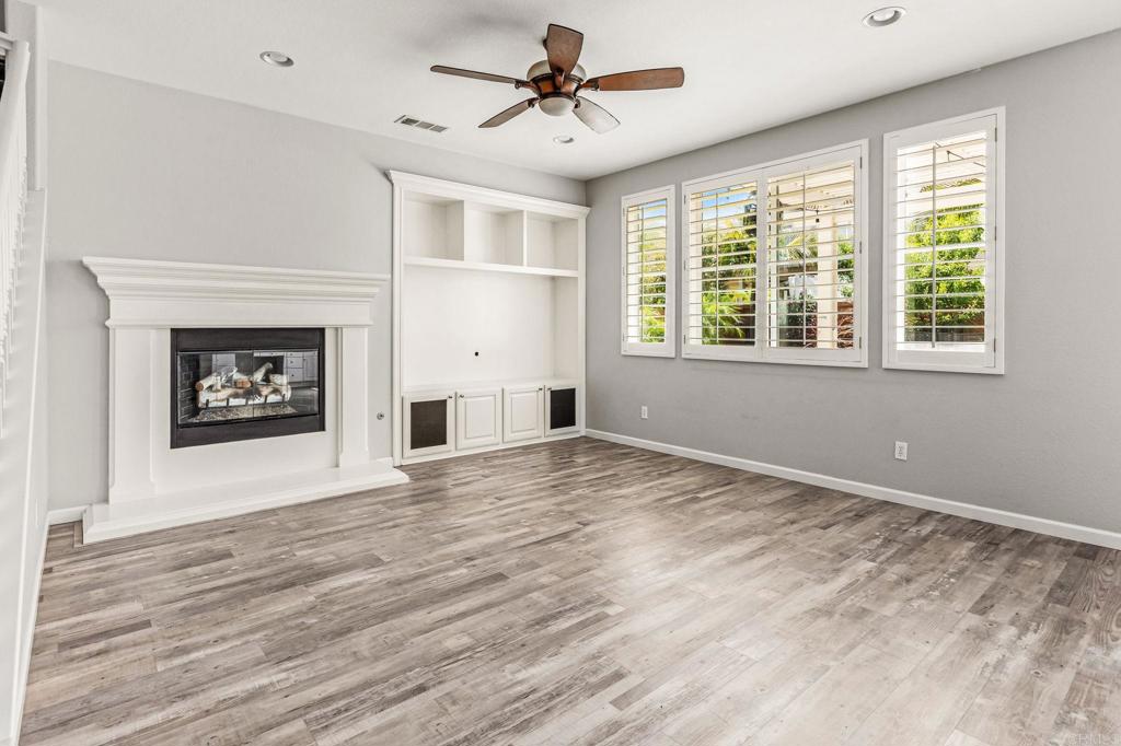 3848 Lake Park Street Fallbrook, CA 92028 - Photo 15 of 35 a view of an empty room with a window and a fireplace