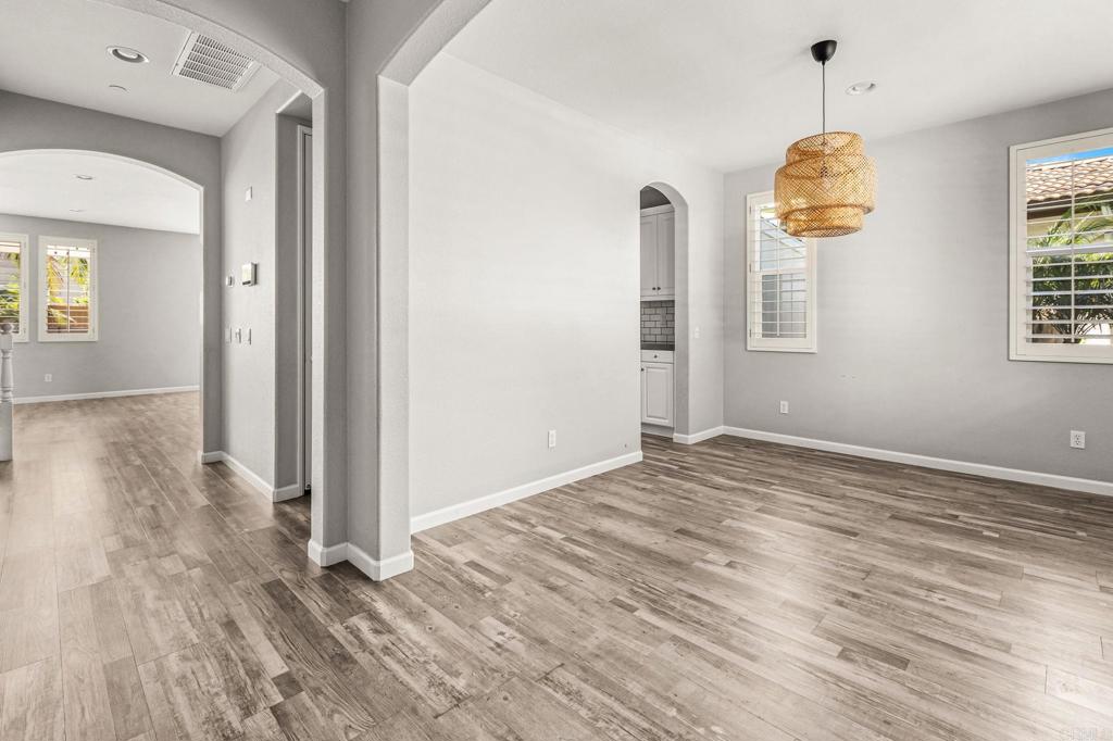 3848 Lake Park Street Fallbrook, CA 92028 - Photo 7 of 35 wooden floor in an empty room with a window