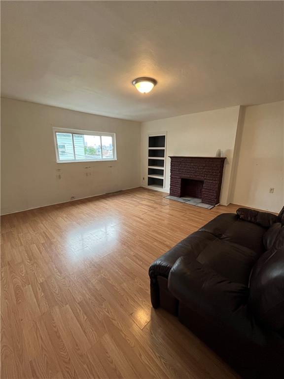 67 Barry Street Pittsburgh, PA 15203 - Photo 2 of 17 a living room with furniture and a ceiling fan
