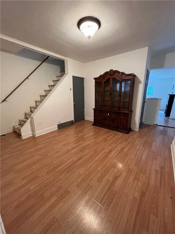 67 Barry Street Pittsburgh, PA 15203 - Photo 4 of 17 a view of an empty room with wooden floor and a window