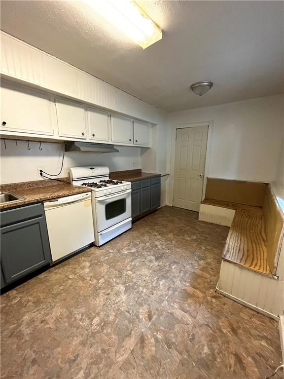67 Barry Street Pittsburgh, PA 15203 - Photo 5 of 17 a kitchen with a stove a sink and a refrigerator