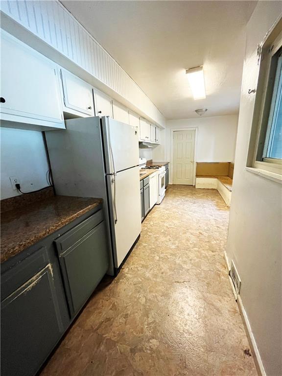 67 Barry Street Pittsburgh, PA 15203 - Photo 6 of 17 a kitchen with refrigerator and window