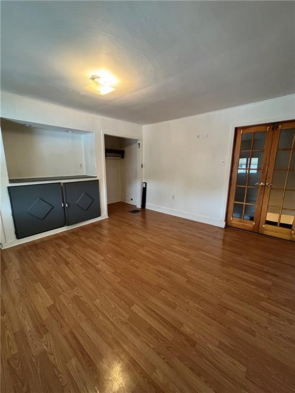 67 Barry Street Pittsburgh, PA 15203 - Photo 7 of 17 a view of an empty room with wooden floor and a window