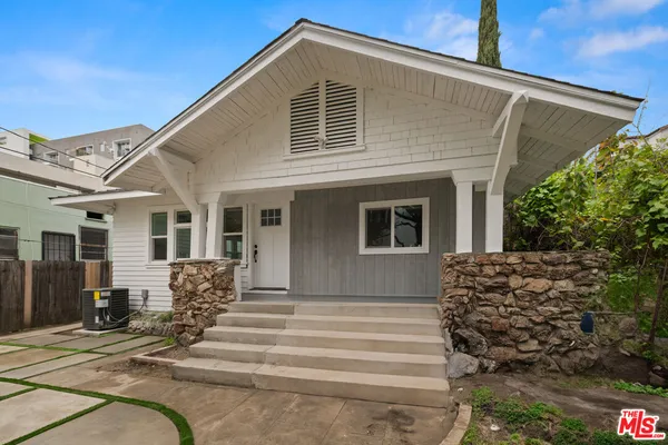 a front view of a house with a porch