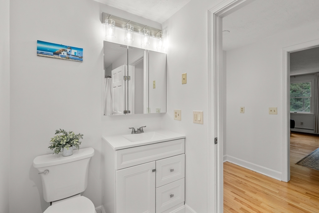 322 Concord Road Wayland, MA 01778 - Photo 18 of 35 a bathroom with a toilet sink vanity and granite