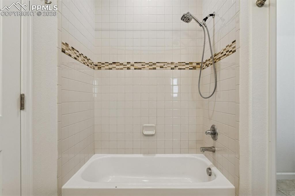 960 Fire Rock Place Colorado Springs, CO 80921 - Photo 13 of 30 a bathroom with a shower and a bathtub