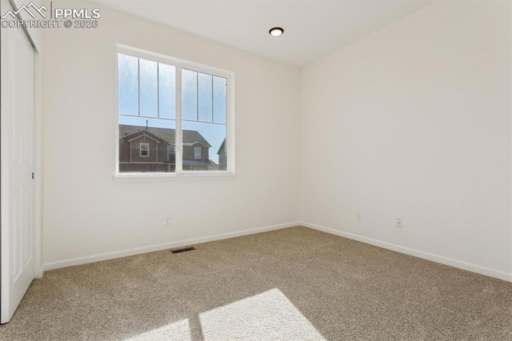 960 Fire Rock Place Colorado Springs, CO 80921 - Photo 17 of 30 an empty room with a window