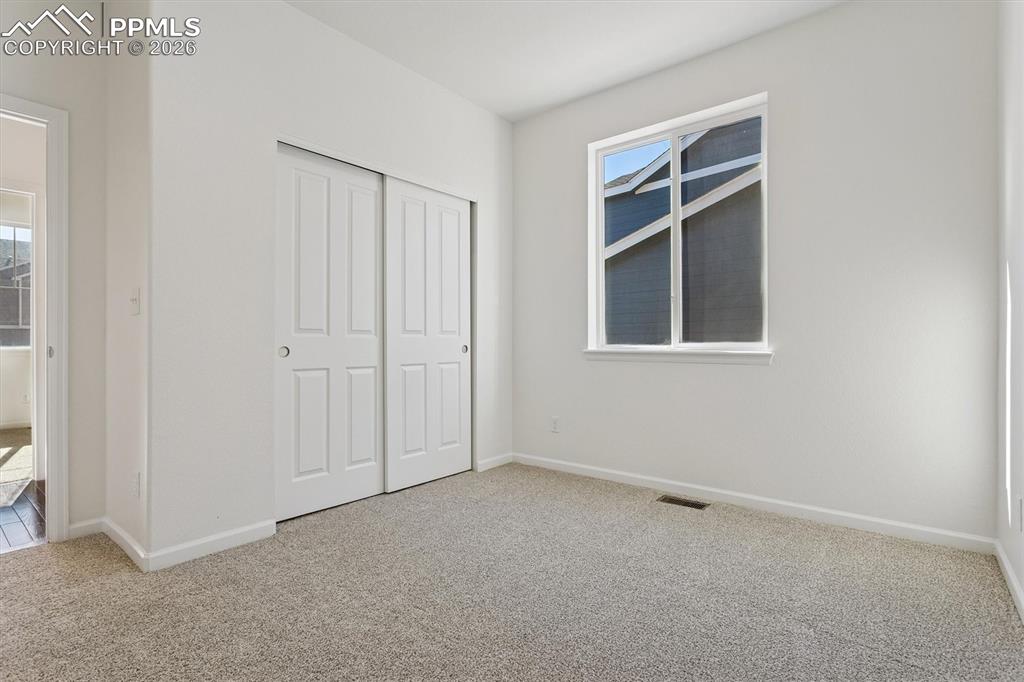 960 Fire Rock Place Colorado Springs, CO 80921 - Photo 18 of 30 a view of an empty room with a window