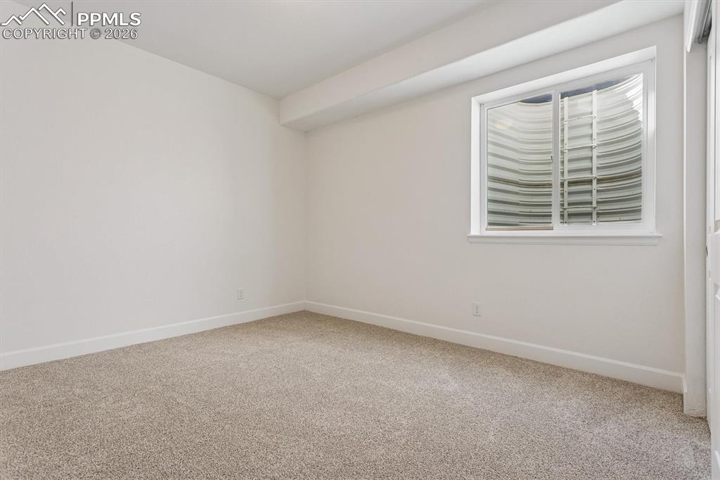 960 Fire Rock Place Colorado Springs, CO 80921 - Photo 23 of 30 an empty room with a window