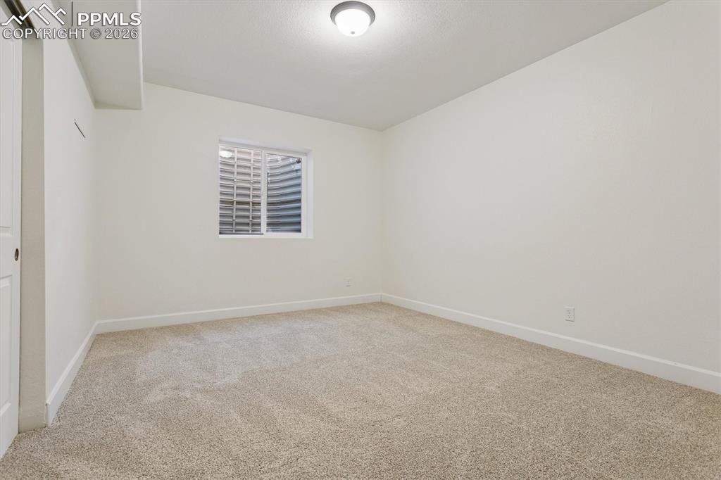 960 Fire Rock Place Colorado Springs, CO 80921 - Photo 25 of 30 an empty room with a window