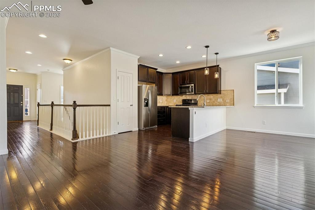 960 Fire Rock Place Colorado Springs, CO 80921 - Photo 4 of 30 a view of large kitchen with stainless steel appliances refrigerator stove microwave and cabinets