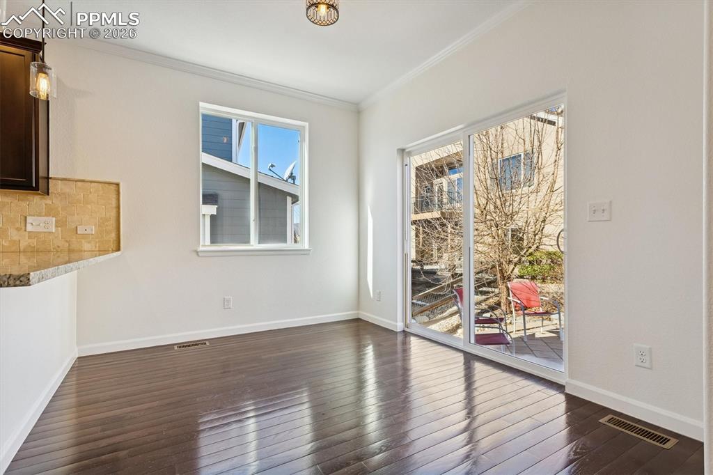 960 Fire Rock Place Colorado Springs, CO 80921 - Photo 10 of 30 a view of livingroom with furniture wooden floor and window