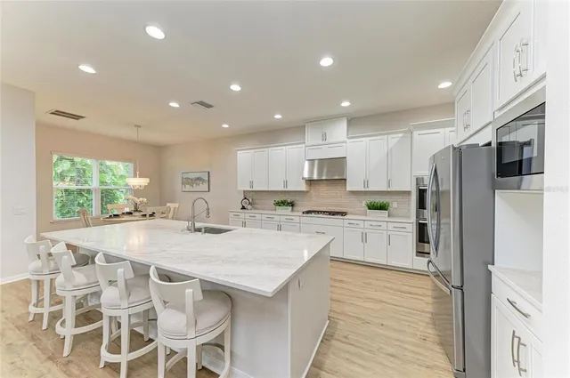 a view of a dining room with furniture window and outside view