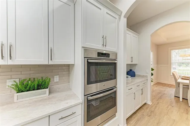 a bathroom with a toilet a sink and a mirror