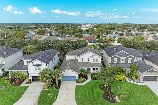an aerial view of a house with a garden