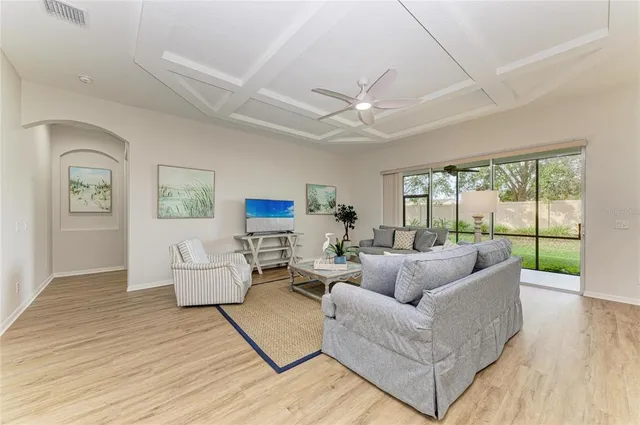 a bathroom with a granite countertop shower sink and mirror