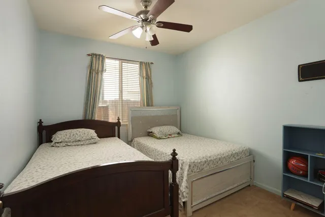 a bedroom with a bed and a tv