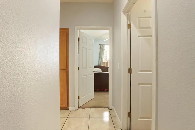 a view of a bathroom from a hallway
