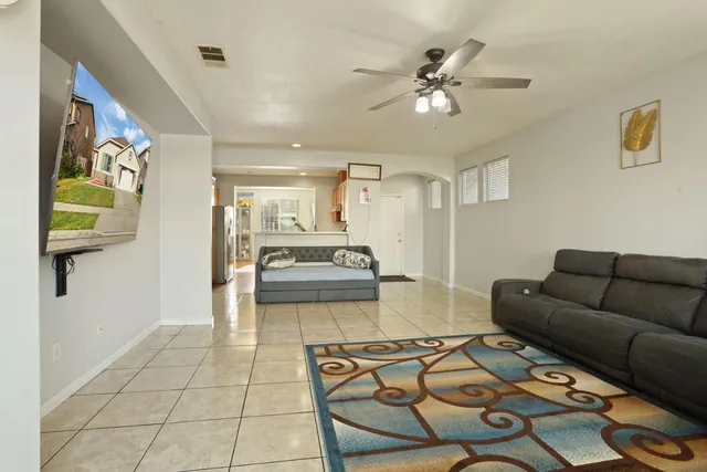 a living room with furniture and a table