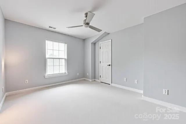 a bedroom with a bed furniture and a window