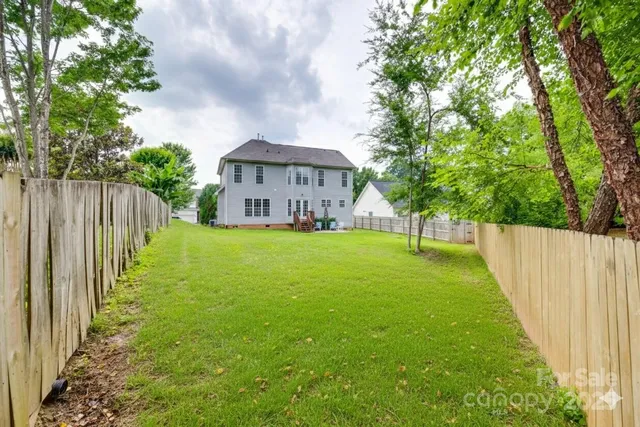 a view of a chair and table in the garden