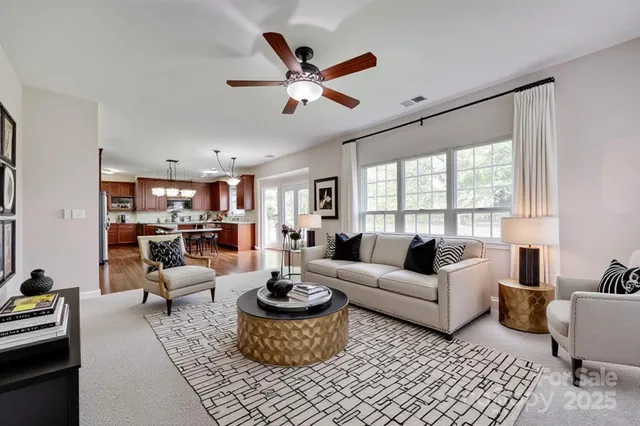 a view of an empty room with a fireplace and a window