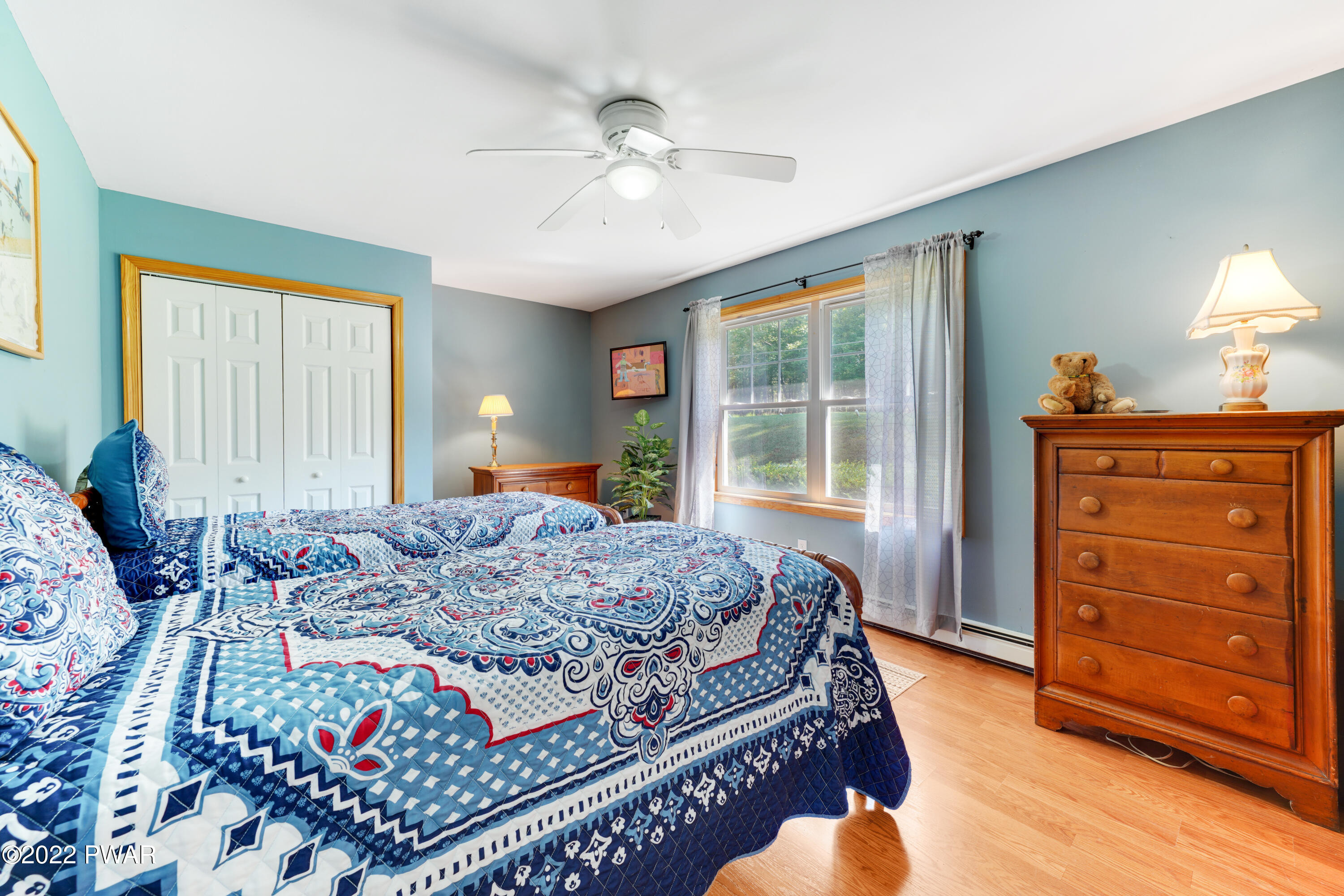 114 Lancaster Road Milford, PA 18337 - Photo 33 of 42 a bedroom with a bed and a dresser in it