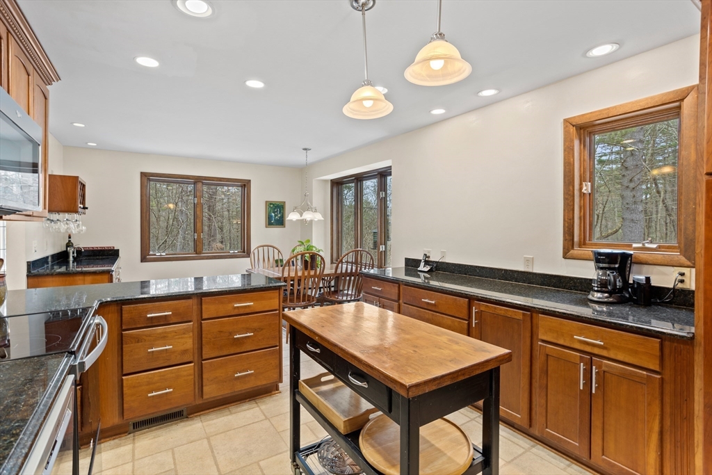 88 Coventry Wood Road Bolton, MA 01740 - Photo 12 of 41 a kitchen with a sink appliances and a counter top space