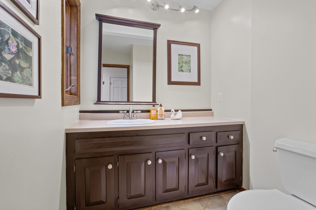 88 Coventry Wood Road Bolton, MA 01740 - Photo 16 of 41 a bathroom with a sink and a toilet
