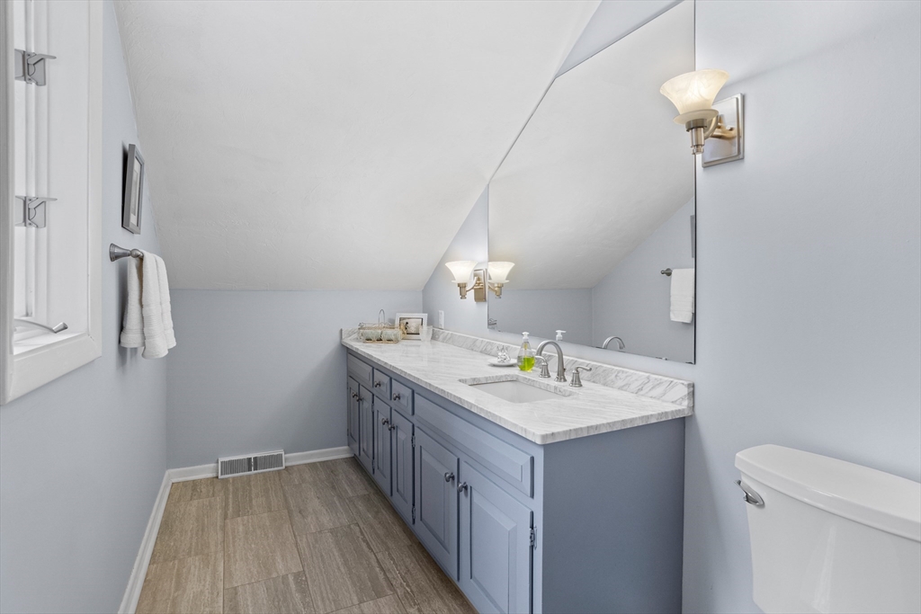 88 Coventry Wood Road Bolton, MA 01740 - Photo 23 of 41 a bathroom with a sink a vanity and a mirror