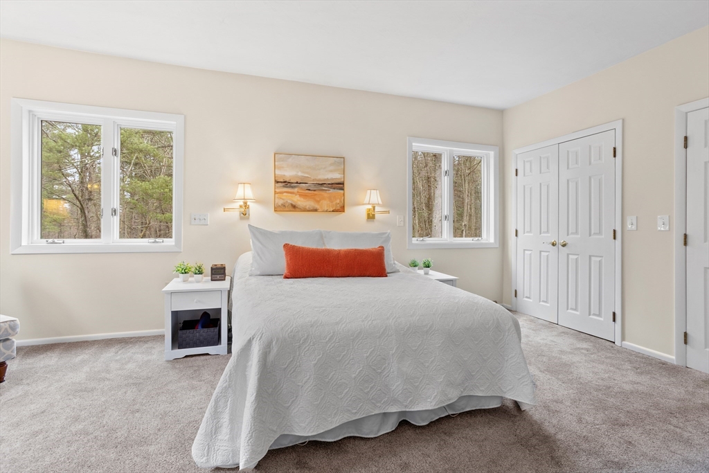 88 Coventry Wood Road Bolton, MA 01740 - Photo 24 of 41 a bedroom with a bed and wooden floor