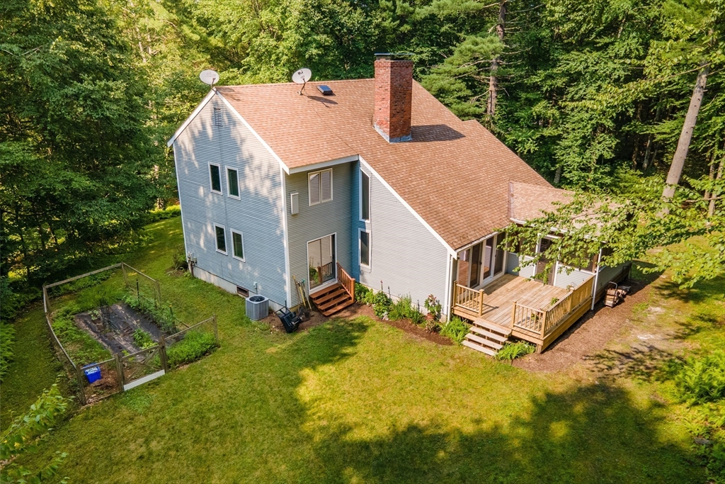 88 Coventry Wood Road Bolton, MA 01740 - Photo 31 of 41 an aerial view of residential houses with yard