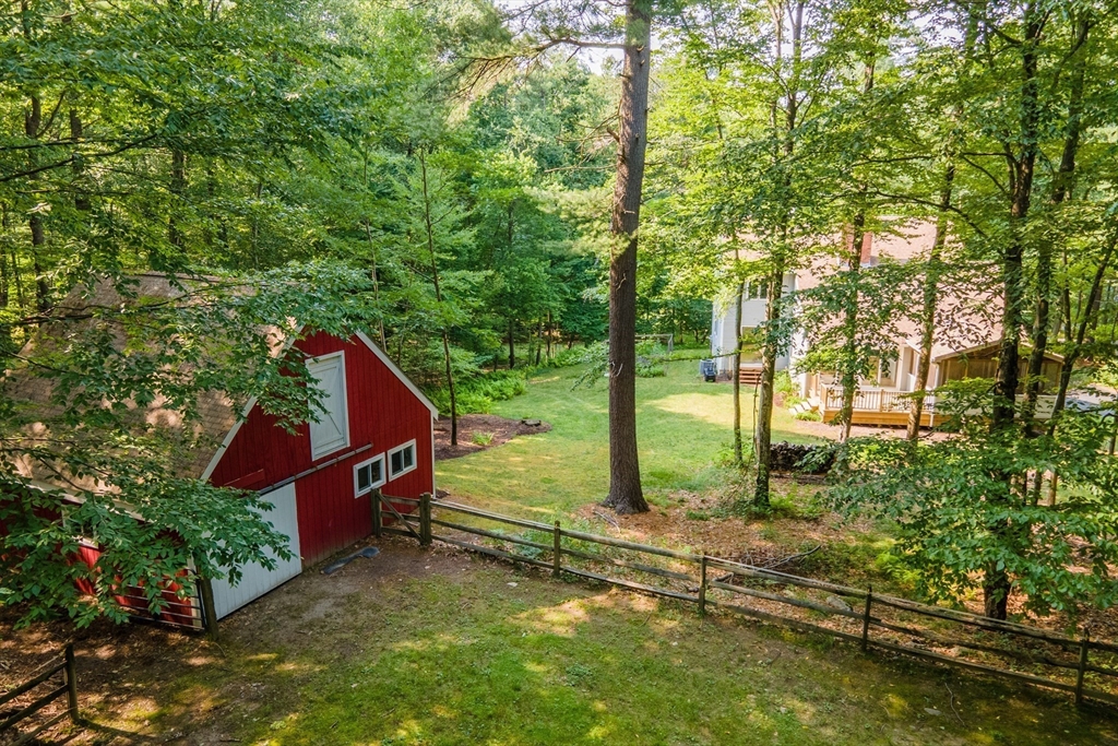 88 Coventry Wood Road Bolton, MA 01740 - Photo 36 of 41 a view of a garden with a house