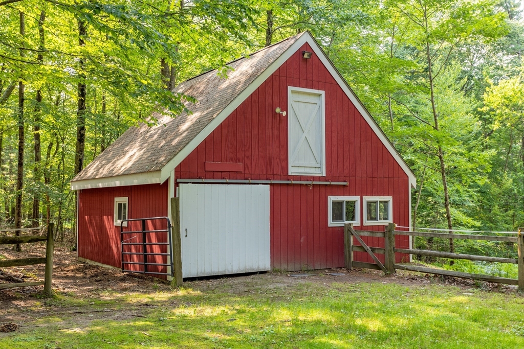 88 Coventry Wood Road Bolton, MA 01740 - Photo 37 of 41 a view of backyard with a barn and large trees