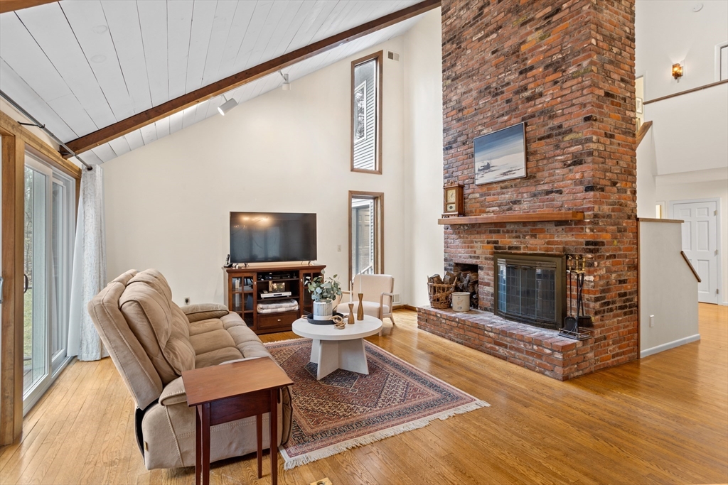 88 Coventry Wood Road Bolton, MA 01740 - Photo 5 of 41 a living room with furniture and a fireplace