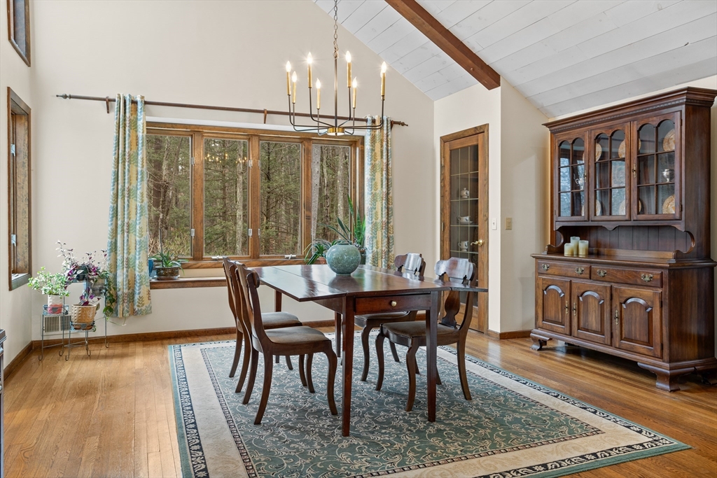 88 Coventry Wood Road Bolton, MA 01740 - Photo 8 of 41 a view of a dining room with furniture window and wooden floor