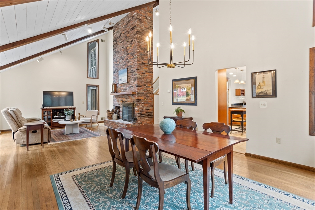 88 Coventry Wood Road Bolton, MA 01740 - Photo 9 of 41 a dining room with furniture and wooden floor