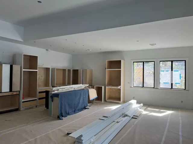 a bed room with furniture and a window