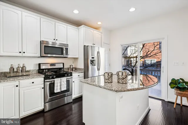 a view of a wooden deck with a yard