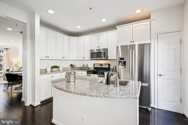 a view of entryway livingroom and hallway with wooden floor