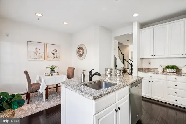 a bathroom with a sink a mirror and a bathtub